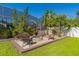 Relaxing backyard with fire pit and seating area at 11418 Lake Eustis Dr, Leesburg, FL 34788