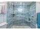 Large walk-in shower with glass enclosure and modern tile at 11418 Lake Eustis Dr, Leesburg, FL 34788