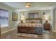 Main bedroom with dark wood furniture and hardwood floors at 11418 Lake Eustis Dr, Leesburg, FL 34788