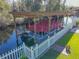 Covered boat dock with a pontoon boat on a canal at 11418 Lake Eustis Dr, Leesburg, FL 34788