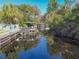Tranquil canal view with private boat dock and lush landscaping at 11418 Lake Eustis Dr, Leesburg, FL 34788
