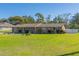 Ranch-style brick home with a large yard at 11418 Lake Eustis Dr, Leesburg, FL 34788