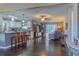 Open concept kitchen and living area with hardwood floors at 11418 Lake Eustis Dr, Leesburg, FL 34788