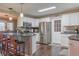 Modern kitchen with stainless steel appliances and island at 11418 Lake Eustis Dr, Leesburg, FL 34788