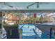 Relaxing poolside patio with comfortable seating and a TV at 11418 Lake Eustis Dr, Leesburg, FL 34788