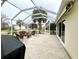 Spacious screened lanai with patio furniture and grill at 15715 Sw 11Th Terrace Rd, Ocala, FL 34473