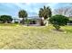 Screened patio and grassy backyard with palm trees at 15715 Sw 11Th Terrace Rd, Ocala, FL 34473