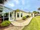 Landscaped backyard with walkway and screened enclosure at 15715 Sw 11Th Terrace Rd, Ocala, FL 34473