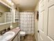 Full bathroom featuring a vanity, decorative shower curtain and a toilet at 15715 Sw 11Th Terrace Rd, Ocala, FL 34473