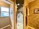Bathroom with a glass shower stall, neutral wall color, and decorative shower door at 15715 Sw 11Th Terrace Rd, Ocala, FL 34473
