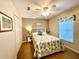 Cozy bedroom featuring a ceiling fan, neutral paint and double door closet at 15715 Sw 11Th Terrace Rd, Ocala, FL 34473