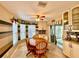 Cozy breakfast nook with a wooden dining table, and a large sliding glass door at 15715 Sw 11Th Terrace Rd, Ocala, FL 34473
