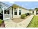 The home's exterior boasts a landscaped walkway and screened-in patio for outdoor enjoyment at 15715 Sw 11Th Terrace Rd, Ocala, FL 34473