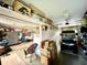 Garage with golf cart, shelving and storage space at 15715 Sw 11Th Terrace Rd, Ocala, FL 34473