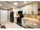 Bright kitchen featuring stainless steel appliances, granite countertops, and modern cabinetry at 15715 Sw 11Th Terrace Rd, Ocala, FL 34473