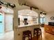 Open kitchen with breakfast bar and stainless steel appliances at 15715 Sw 11Th Terrace Rd, Ocala, FL 34473