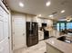 Modern kitchen features stainless steel appliances, granite counters, and tiled floors at 15715 Sw 11Th Terrace Rd, Ocala, FL 34473