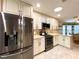 Bright kitchen featuring stainless steel appliances, granite countertops, and modern cabinetry at 15715 Sw 11Th Terrace Rd, Ocala, FL 34473