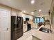 Bright kitchen with granite counters, stainless steel appliances, and tiled floors at 15715 Sw 11Th Terrace Rd, Ocala, FL 34473