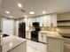 Bright kitchen featuring stainless steel appliances, granite countertops, and modern cabinetry at 15715 Sw 11Th Terrace Rd, Ocala, FL 34473