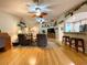 Spacious living room with hardwood floors, comfortable seating, ceiling fans, and access to the kitchen at 15715 Sw 11Th Terrace Rd, Ocala, FL 34473