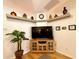 Corner nook features display shelves, media console, and a decorative potted plant at 15715 Sw 11Th Terrace Rd, Ocala, FL 34473