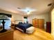 Spacious main bedroom featuring hardwood floors, ceiling fan, and neutral paint at 15715 Sw 11Th Terrace Rd, Ocala, FL 34473
