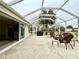 Screened lanai with outdoor furniture, a ceiling fan, and a view of the backyard at 15715 Sw 11Th Terrace Rd, Ocala, FL 34473