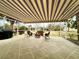 Relaxing screened patio with seating area, retractable awning, and built-in grill at 15715 Sw 11Th Terrace Rd, Ocala, FL 34473