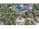 Aerial view of property with two houses and a pond at 16434 Se 57 Pl, Ocklawaha, FL 32179
