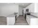 Modern kitchen boasting white cabinets, granite countertops, and stainless steel appliances at 16434 Se 57 Pl, Ocklawaha, FL 32179
