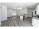 Bright open-concept space combining the living room and kitchen, with modern finishes at 16434 Se 57 Pl, Ocklawaha, FL 32179