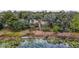 Aerial view of property with lake access and lush vegetation at 16450 Se 57Th Pl, Ocklawaha, FL 32179