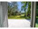 Backyard features a patio with view of lush landscaping and trees at 16450 Se 57Th Pl, Ocklawaha, FL 32179