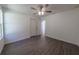 Bright bedroom features modern ceiling fan, light gray flooring, and access to en suite bathroom at 16450 Se 57Th Pl, Ocklawaha, FL 32179