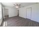 Spacious bedroom featuring wood-look flooring, neutral walls and a large closet at 16450 Se 57Th Pl, Ocklawaha, FL 32179
