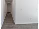Hallway with gray flooring connects to bedrooms and common areas at 16450 Se 57Th Pl, Ocklawaha, FL 32179