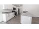 Modern kitchen boasting white cabinets, granite countertops, and stainless steel appliances at 16450 Se 57Th Pl, Ocklawaha, FL 32179