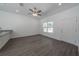 Open living area with modern flooring and white walls, plus a stainless steel kitchen sink at 16450 Se 57Th Pl, Ocklawaha, FL 32179