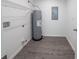 Functional utility room with water heater, hook ups, and plenty of space at 16450 Se 57Th Pl, Ocklawaha, FL 32179