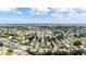 Aerial view of a residential community with houses surrounded by trees and greenery at 17606 Se 93Rd Butler Ct, The Villages, FL 32162