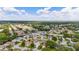 Aerial view of a residential area featuring houses, landscaping, and roads at 17606 Se 93Rd Butler Ct, The Villages, FL 32162