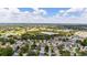 Aerial image showing a residential area near a golf course and power substation at 17606 Se 93Rd Butler Ct, The Villages, FL 32162