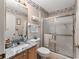 Updated bathroom with granite vanity and walk-in shower at 17606 Se 93Rd Butler Ct, The Villages, FL 32162