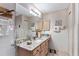 Bathroom with granite vanity and tiled floor at 17606 Se 93Rd Butler Ct, The Villages, FL 32162