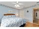 Bright bedroom with a king-size bed and built-in closet at 17606 Se 93Rd Butler Ct, The Villages, FL 32162