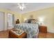 Comfortable bedroom with a king-size bed and en-suite bathroom at 17606 Se 93Rd Butler Ct, The Villages, FL 32162