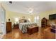Main bedroom showcasing a king-size bed and wood furniture at 17606 Se 93Rd Butler Ct, The Villages, FL 32162