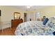 Bedroom with king-size bed and access to bathroom at 17606 Se 93Rd Butler Ct, The Villages, FL 32162