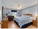 Spacious bedroom with a king-size bed and ocean-themed decor at 17606 Se 93Rd Butler Ct, The Villages, FL 32162